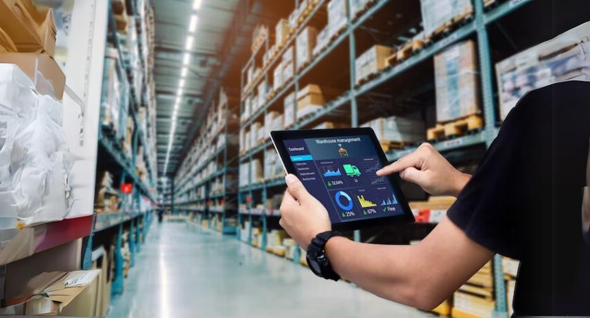 smart-warehouse-management-system-worker-hands-holding-tablet-blurred-warehouse-as-background